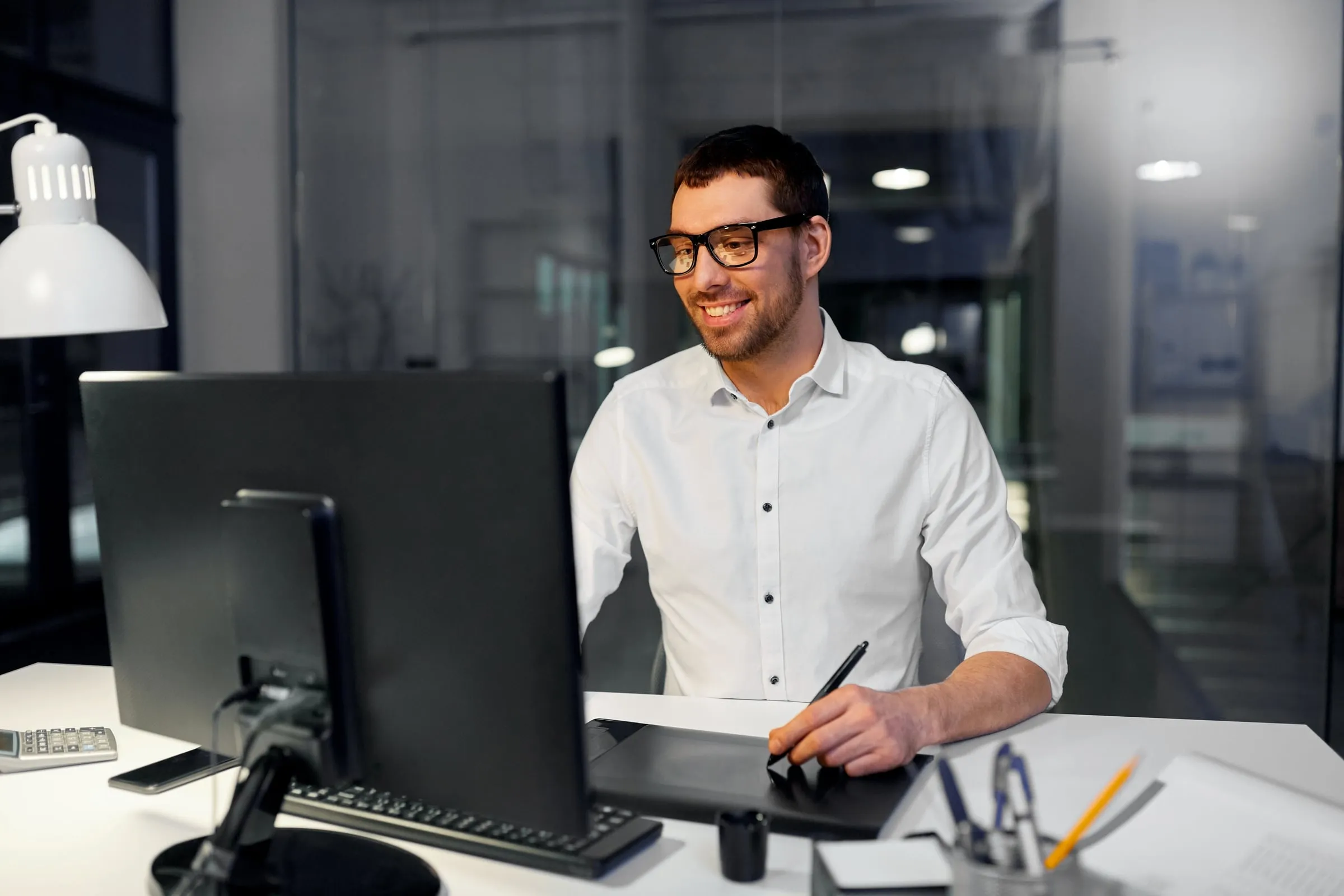 Professional reviewing figures and documents at a desk