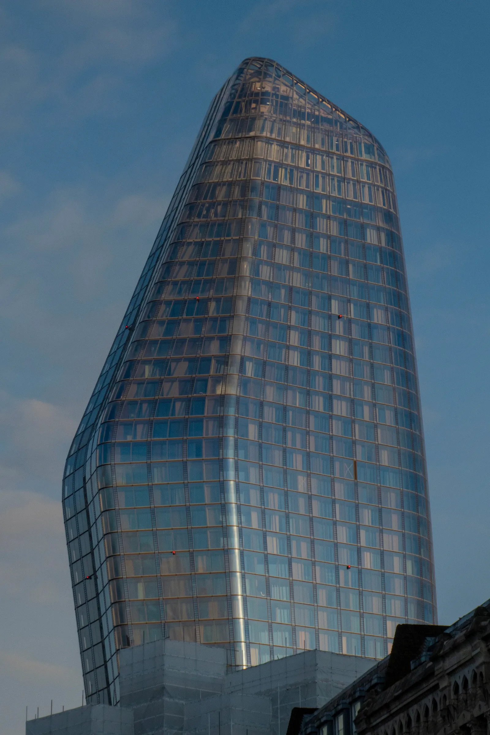 The curved glass facade of One Blackfriars in London photographed from street level