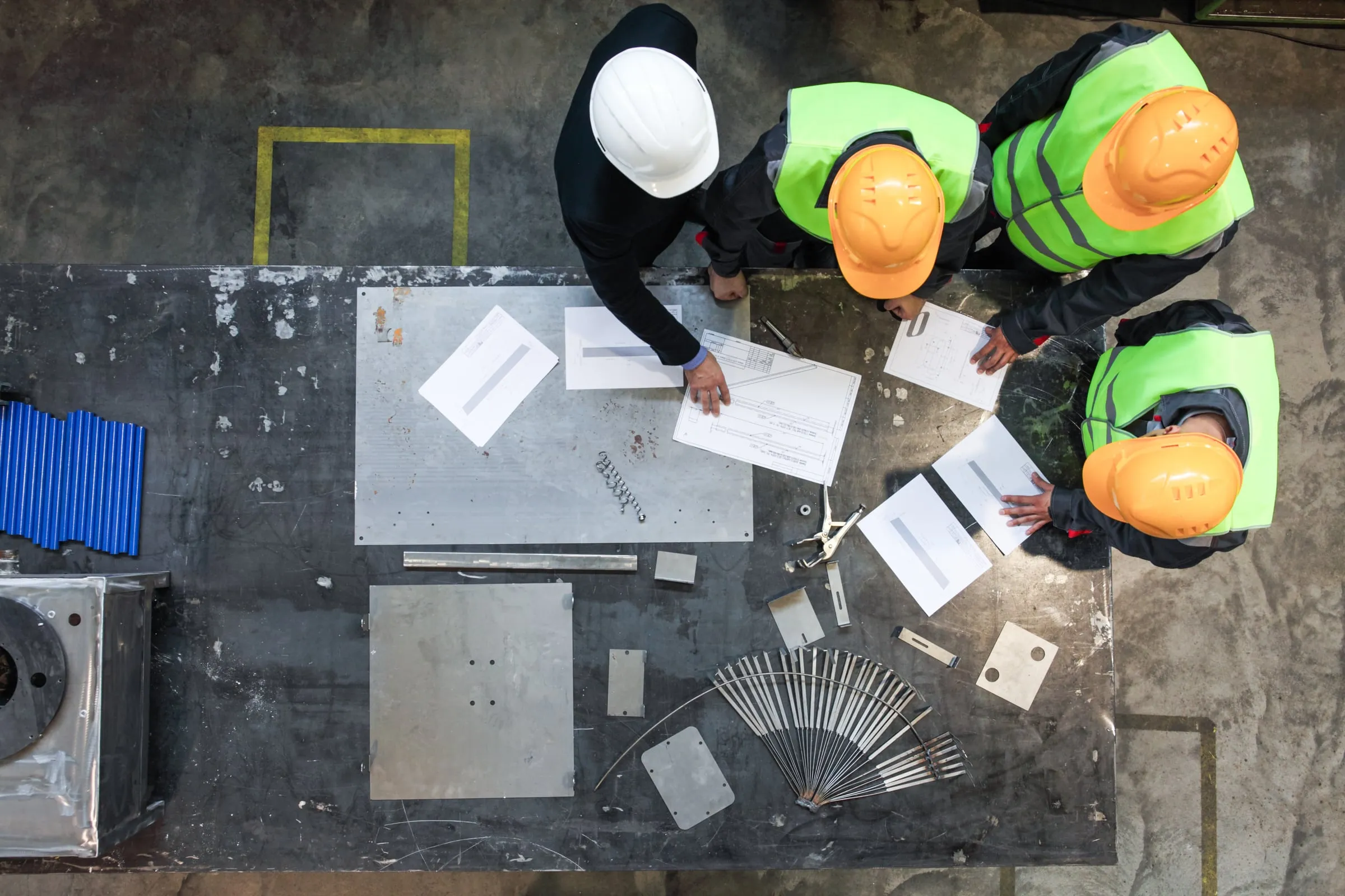 Construction project team reviewing plans together